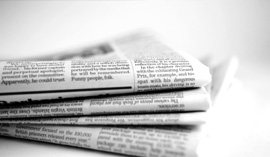 stacked newspapers