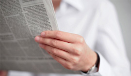 person holding newspaper